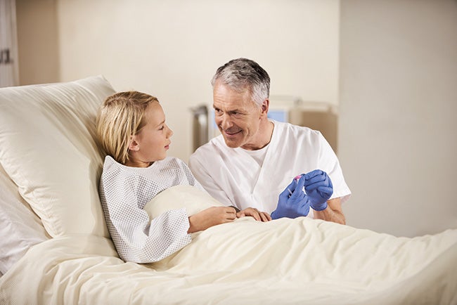 nurse and patient boy example image patient access and off label use in pediatrics