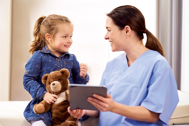 nurse and child pediatric examination room