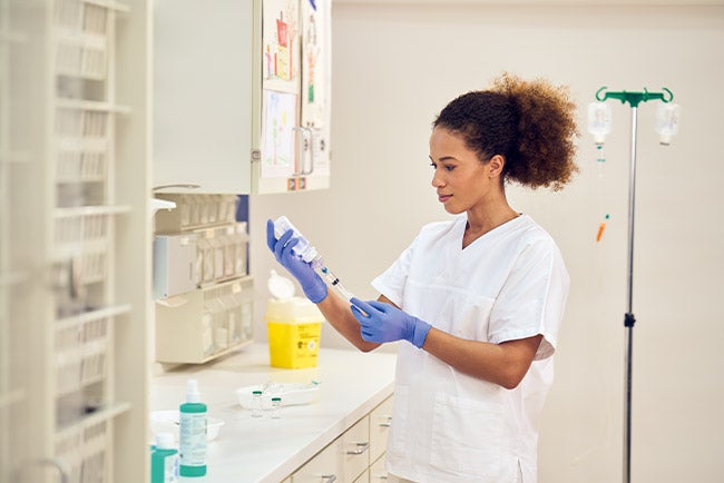 nurse preparing pediatric and neonatal products
