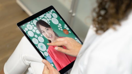 Asian nurse on iPad Screen