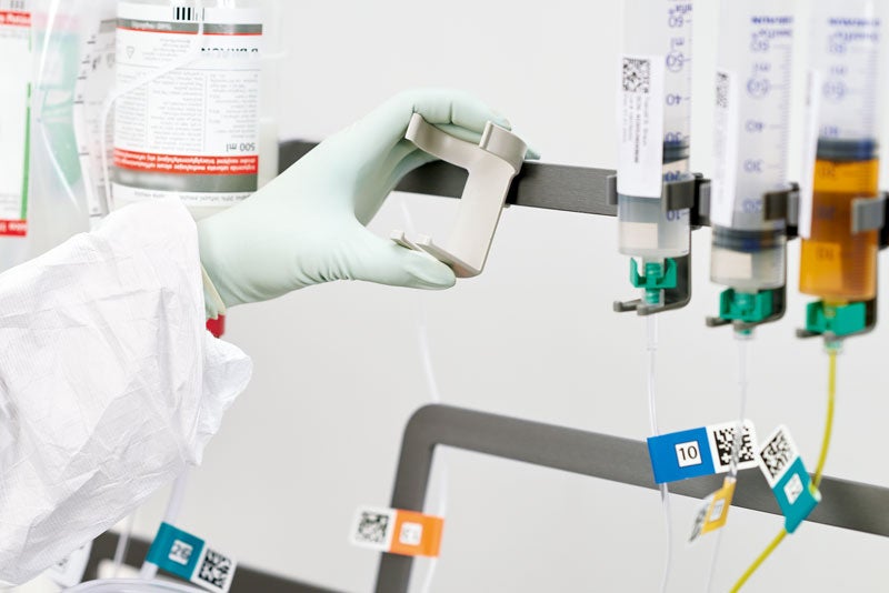 Automated nutrition compounding: Apex vial holder clips