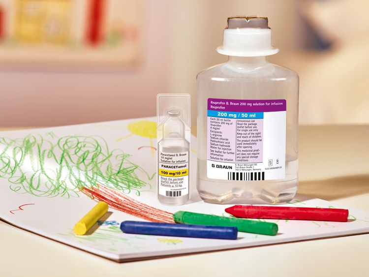 Paracetamol and ibupofen stand on a painted picture of a tree