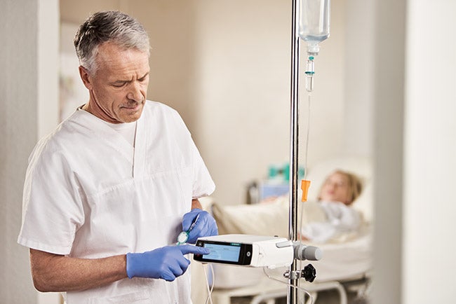 nurse and pediatric patient with spaceplus drug application