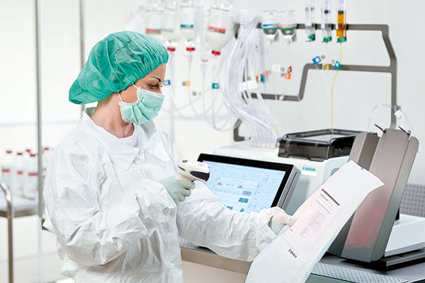 Pharmacist scanning barcode for automated tpn compounding
