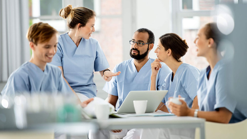 Healthcare workers exchange views